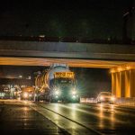 The Omega Morgan truck carrying the 240,000 pound autoclave going through the underpass.