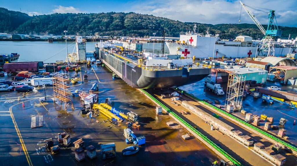 moving 4,000 ton double-hulled tank barge 750 feet over land using jack and slide system