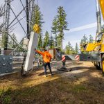 Cellular antennas being lifted to the top of the Bremerton Cell tower.