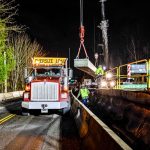 One of nine 63,200-pound girders being moved by the Omega Morgan Crane Services team.