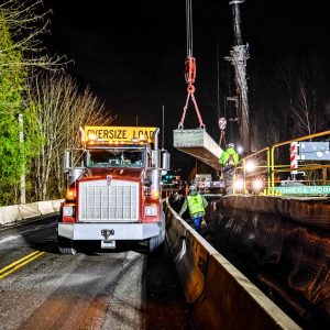 A 63,200-pound girder being moved by Omega Morgan crane services.