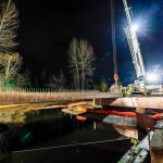 Omega Morgan crew sets one of nine girders in place to elevate a road in Kent, WA.