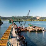 A 35’ bridge span is moved into place by the millwright team of Omega Morgan.