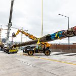 Omega Morgan landing the totem pole with their Tadano crane after safe removal.