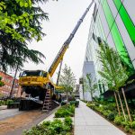 A view from downhill of Omega Morgan’s Grove GMK6350L crane and the 4 feet of mats to ensure a safe lift.