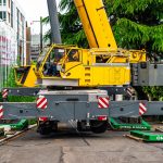 A side view of Omega Morgan’s Grove GMK6350L crane.