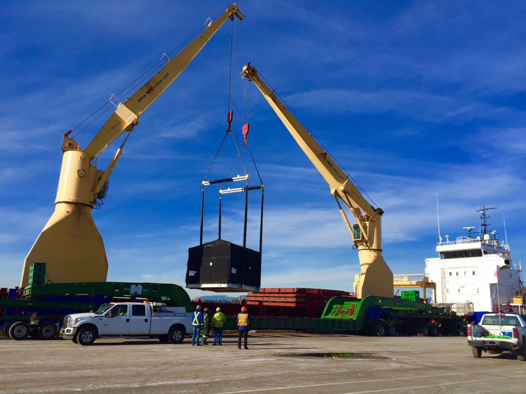 Lifting compressor package over 150-ton dual lane trailer