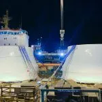 2 turbine runners strapped down to the barge to ensure safe travels down the inlet.