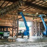 Omega Morgan is preparing to coordinate a move of a flight conveyor with three forklifts.