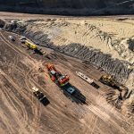 An overhead shot of the Omega Morgan specialized transportation crew preparing to load a 600,000-pound mining shovel onto our heavy haul truck.