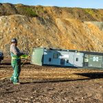 An Omegan Morgan crew member prepares for a safe heavy equipment transport up a five to ten-grade canyon road.