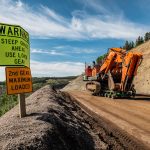 Omega Morgan’s specialized transportation crew expertly transports a 600,000-pound mining shovel up a steep mountain road.