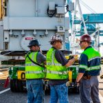 Omega Morgan crew members discuss safety plans before moving forward with transport.