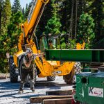 Omega Morgan crews use forklifts to place steel girders.