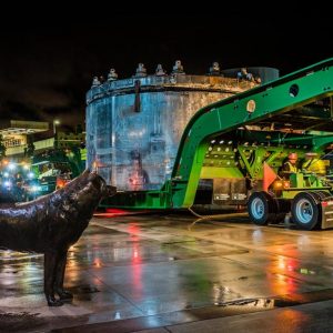 tunnel boring machine in transport in front of husky stadium