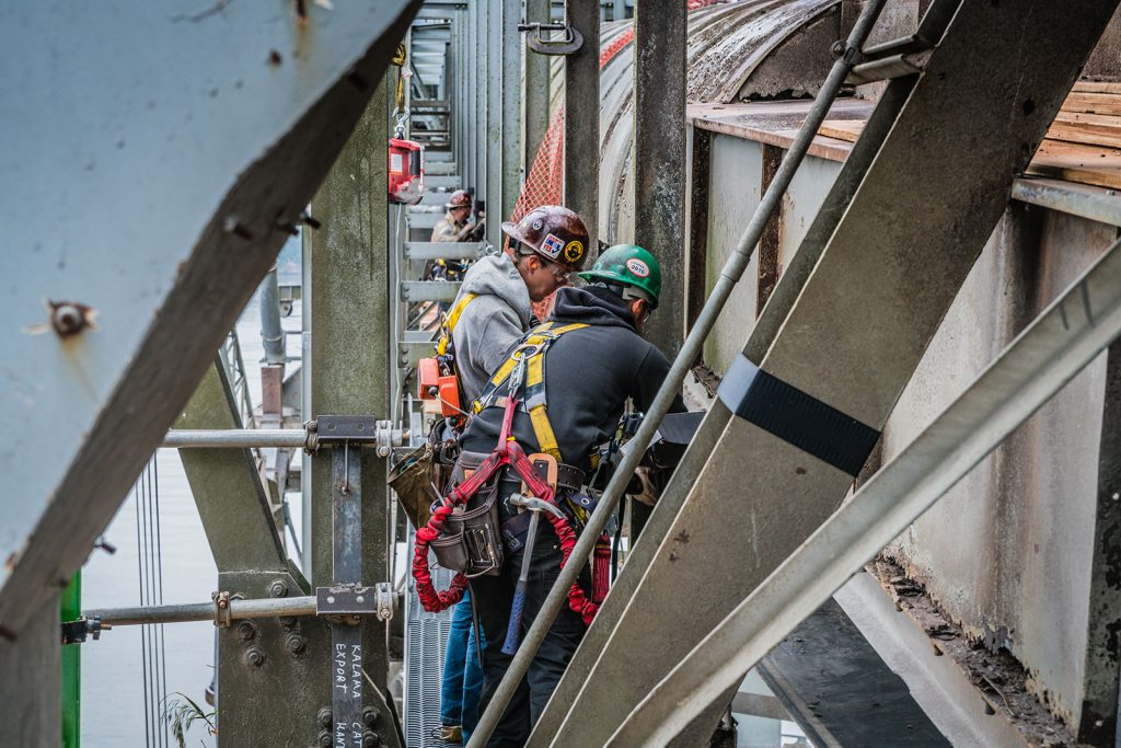 two omega morgan crew members performing onsite steel repair