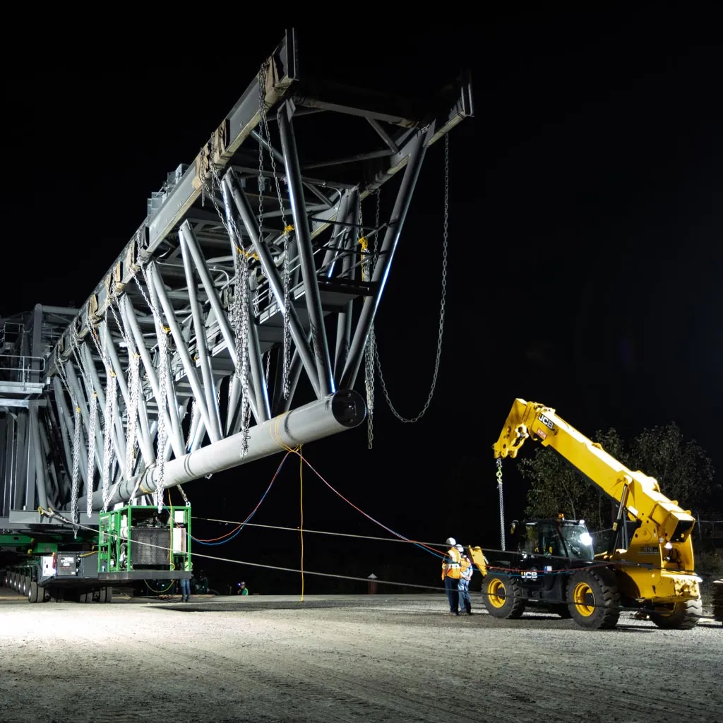 A ship loader in Vancouver, Washington being rigged for heavy lift and transport at night