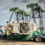Omega Morgan crews ready to lift a 140,000 pound aluminum can press with tandem trilifters