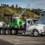 Omega Morgan forklift used to assist tandem trilifters in moving a 140,000 pound aluminum can press