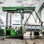 a 140,000 pound aluminum can press being moved by Omega Morgan tandem trilifters