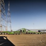 Omega Morgan’s double Schnabel trailer connected before loading wind energy components for transport.